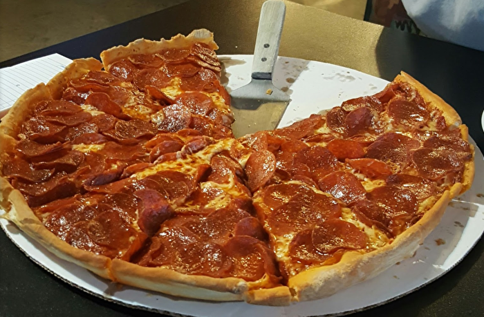 Pepperoni pizza on table at Bakers Pizza in Maysville Oklahoma