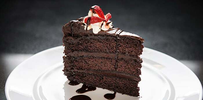 Chocolate cake with strawberries on plate in Chickasaw Country