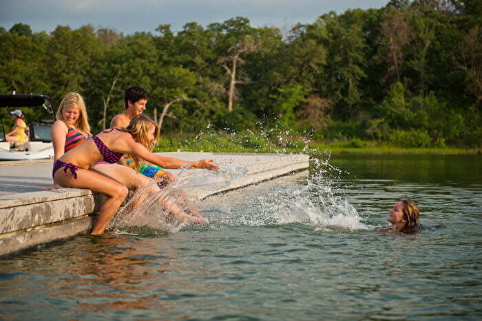 Friends splashing in water