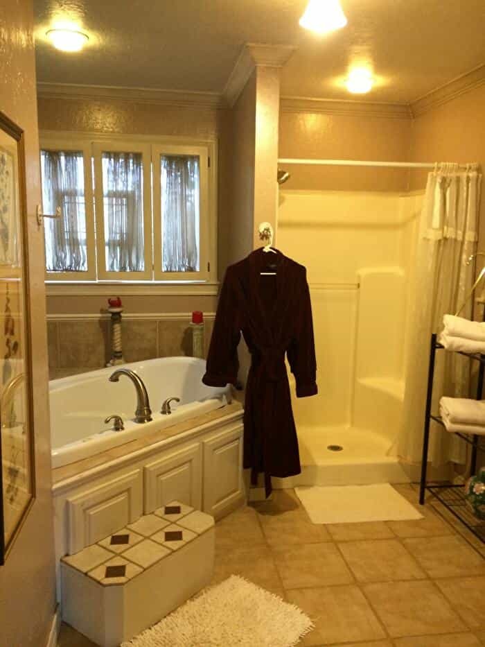 Robe in relaxing bathroom at Lindley house garden cottages in Duncan Oklahoma