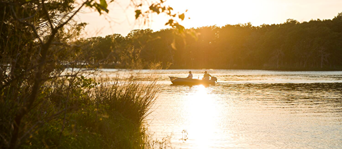 People fishing on lake