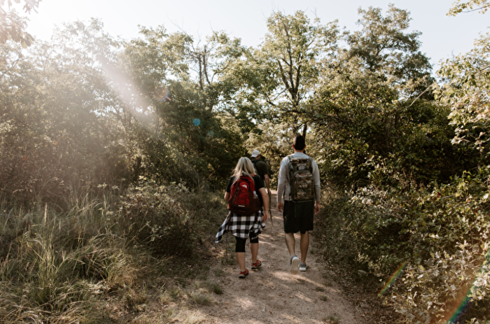 People hiking on a trail in Chickasaw Country