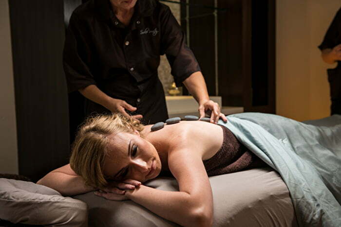 Hot stones during massage at Solerenity in The Artesian Hotel