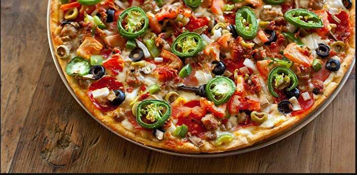 Supreme pizza on a table at Ten Star Pizza Kitchen in Ardmore Oklahoma